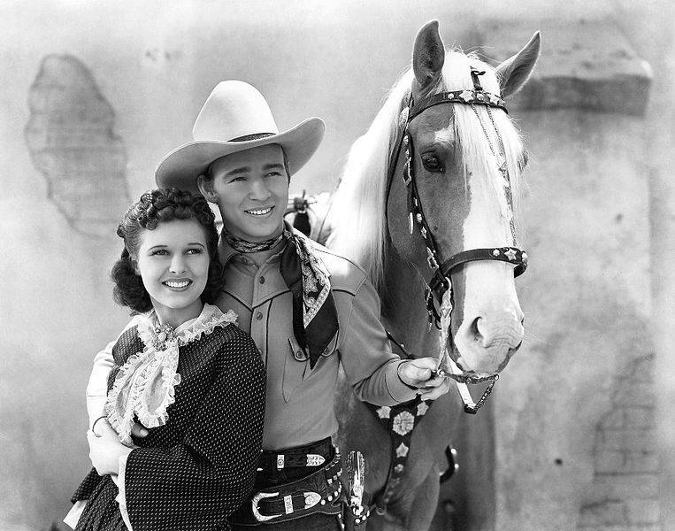 Lynne Roberts and Roy Rogers wearing a white hat in Billy the Kid Returns
