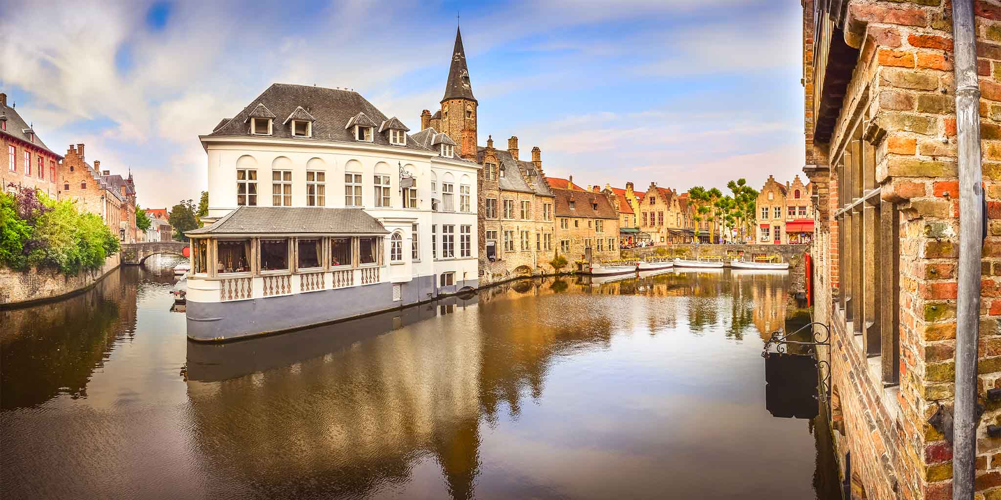 Channels of famous water canal in Bruges, Belgium